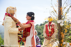 Couple exchanging jaimalas Couple exchanging jaimalas