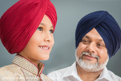 Ring bearer boy wearing a red turban. Ring bearer boy wearing a red turban.