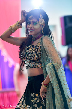 Indian bride in a stunning sangeet outfit. sangeet indian bride and groom,indian pre-wedding celebrations