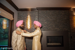 Groom getting ready with family Groom getting ready with family