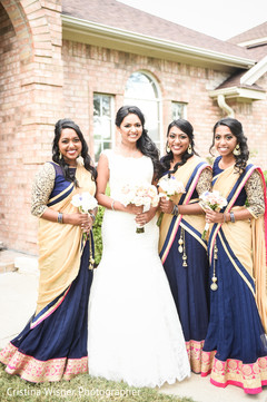 Maharani in white and bridesmaids in blue and yellow saris. Maharani in white and bridesmaids in blue and yellow saris.