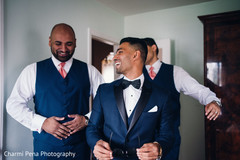Indian groom and groomsmen having a good time before wedding ceremony Indian groom and groomsmen having a good time before wedding ceremony