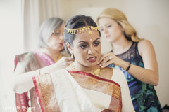 Indian bride and her friends getting ready for wedding ceremony Indian bride and her friends getting ready for wedding ceremony