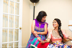 Candid shot of bride and her mother. Candid shot of bride and her mother.