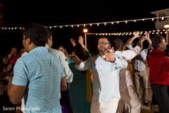 Indian wedding guests dancing at sangeet ceremony Indian wedding guests dancing at sangeet ceremony