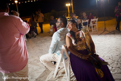 Indian couple having a great time at sangeet ceremony Indian couple having a great time at sangeet ceremony
