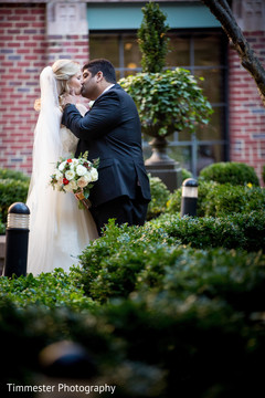 Indian couple kissing photography before wedding reception Indian couple kissing photography before wedding reception