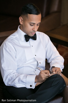 Groom writing love note Groom writing love note