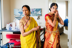 Indian bride preparing her look for her wedding day. indian bride,indian bride getting ready,indian bridal fashions