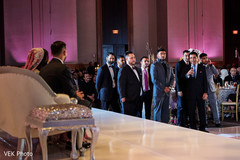 Indian groomsmen saying some words at wedding reception Indian groomsmen saying some words at wedding reception