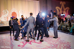 Indian groomsmen dancing at wedding reception Indian groomsmen dancing at wedding reception