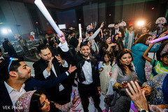 Indian couple and their friends having a good time at wedding reception Indian couple and their friends having a good time at wedding reception