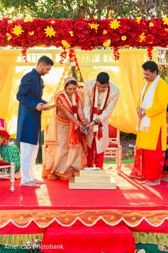 Indian couple lightning the sacred fire. indian wedding photography,indian wedding ceremony,indian bride,indian groom