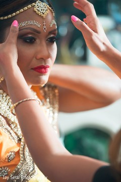 Gorgeous bride's final touch ups. indian bride,indian bride makeup,indian bridal jewelry