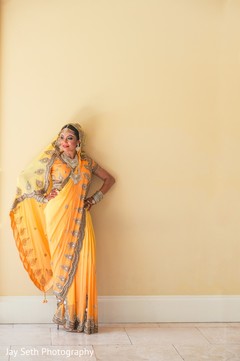 Showstopping bride in a wedding yellow sari. indian bride,indian bridal fashions,indian wedding portrait,indian sari