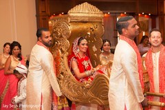Beautiful bride carried in on a palanquin. indian bride,indian wedding ceremony,indian wedding photography