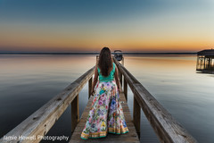 Indian bride walking on dock at wedding venue Indian bride walking on dock at wedding venue