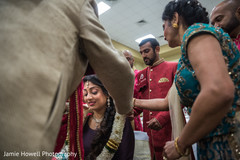 Indian bride wearing a jaimala at sangeet ceremony Indian bride wearing a jaimala at sangeet ceremony