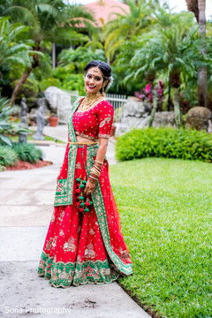 Maharani in red and green wedding outfit. Maharani in red and green wedding outfit.
