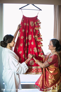 Lovely bride ready to wear her bridal lengha. Lovely bride ready to wear her bridal lengha.