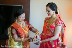 Maharani getting some help with her jewelry. Maharani getting some help with her jewelry.