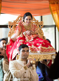 Beautiful bride entering the ceremony on a palanquin. Beautiful bride entering the ceremony on a palanquin.