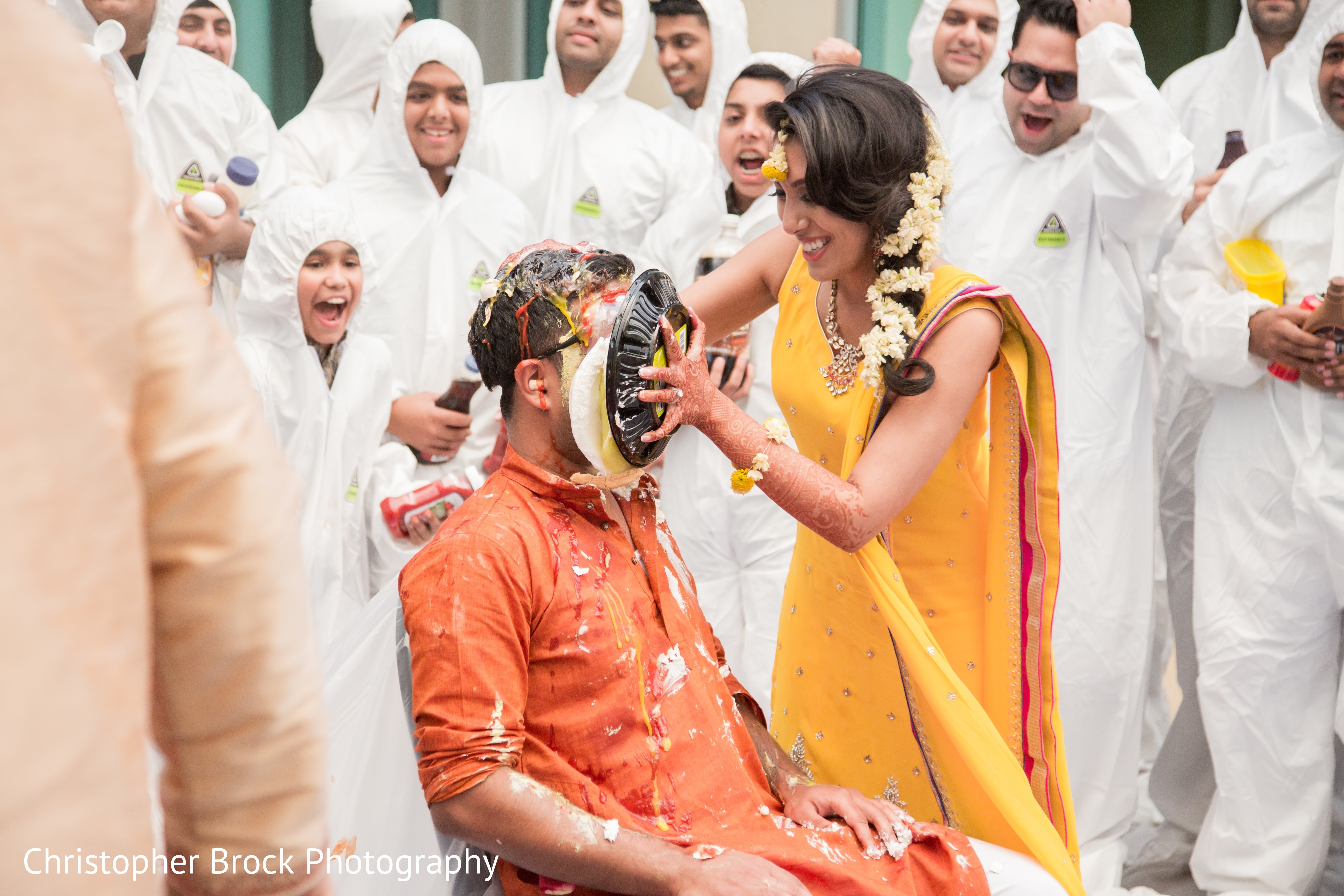 Indian bride throwing a cake to grooms face Photo 106993