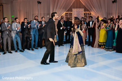 Bride and groom getting the party started reception fashion ideas,indian fusion wedding reception,indian wedding dance,indian wedding lighting