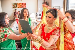Indian bride taking a final look to her hair and makeup indian bride,indian bridal hair and makeup,indian wedding jewelry,indian bride getting ready
