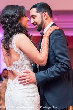 Newlyweds during first dance indian bride and groom first dance,indian wedding reception,indian wedding dress