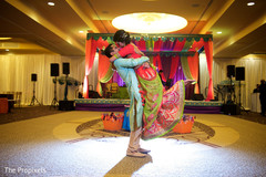 Groom lifting the bride indian wedding couple,indian bridal fashions,indian groom fashion
