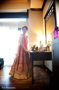 Beautiful bride in her lengha draping,indian bridal lengha,indian wedding lengha