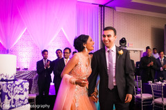 Happy couple about to cut the cake indian wedding gowns,indian groom fashion,suit