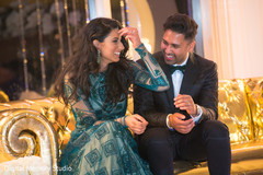 Indian couple laughing photography at wedding reception indian bride hair and makeup,indian bridal jewelry,indian wedding outfits