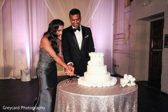 Sweet cake cutting moment. indian bride,indian groom,indian wedding cakes,indian wedding photography