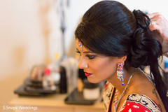 Gorgeous bride's hairstyle. indian bride getting ready,indian bride,indian bridal hair and makeup