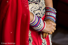 Indian bride's blue red and silver bangles. indian bride,indian wedding lengha,indian wedding bangles,indian wedding mehndi