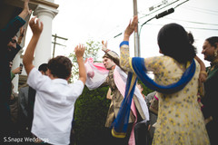 Indian groom dancing during the baraat. indian wedding baraat,indian pre-wedding celebrations,indian wedding,indian groom