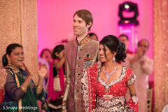 Bride and groom entering as married. indian wedding reception,indian bride