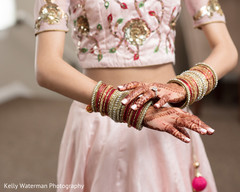 Indian bride showing her bangles and mehndi art photography Indian bride showing her bangles and mehndi art photography