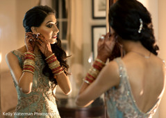 Indian bride getting ready for wedding reception Indian bride getting ready for wedding reception