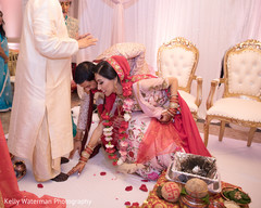 Indian couple touching priest feet at wedding ceremony Indian couple touching priest feet at wedding ceremony