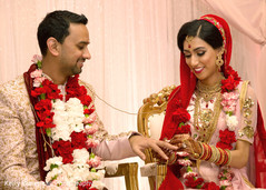 Indian couple exchanging rings at wedding ceremony Indian couple exchanging rings at wedding ceremony