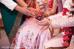Indian couple holding a flower at wedding ceremony indian wedding traditions,indian wedding