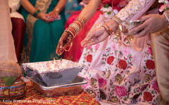 Indian couple enjoin wedding ceremony sacred fire,indian wedding traditions,indian wedding