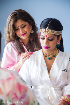 Indian bride preparing her wedding look. indian bride getting ready,indian bridal hair and makeup,indian bridal jewelry