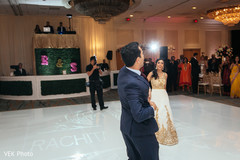 Bride and groom in the dance floor indian fusion wedding reception,indian groom fashion,suit