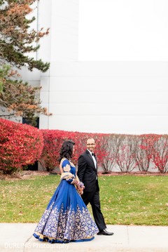 Indian couple walking photography before wedding reception Indian couple walking photography before wedding reception