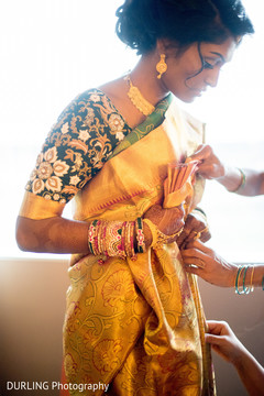 Indian ladies helping the bride to get ready for wedding ceremony Indian ladies helping the bride to get ready for wedding ceremony