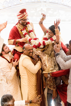 Indian groomsmen carrying the couple at wedding ceremony indian wedding ceremony floral and decor,indian bride and groom,indian wedding henna